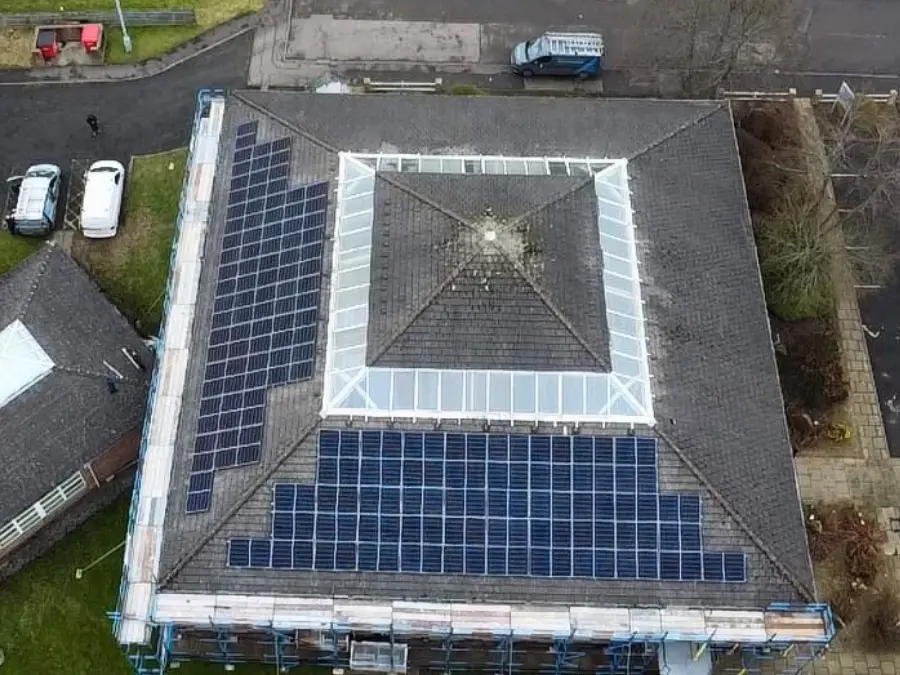 Solar PV panels installed on a residential brick home in Lanarkshire, Scotland
