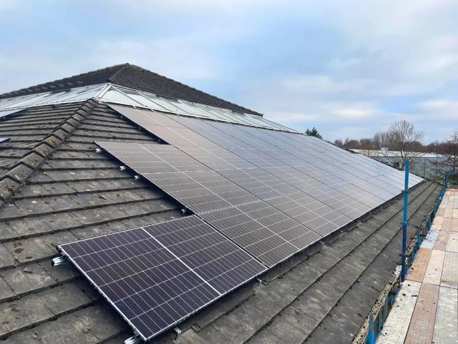 Ecomac Installer installing solar panels on a roof in Glasgow